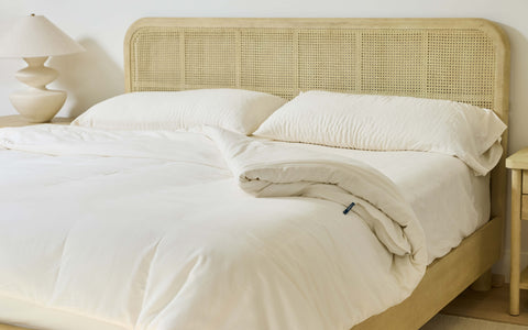 A luxurious bed made with the Avec Align System bedding in a light bone color