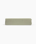 Avec linen fitted sheet in sage folded neatly on a white background